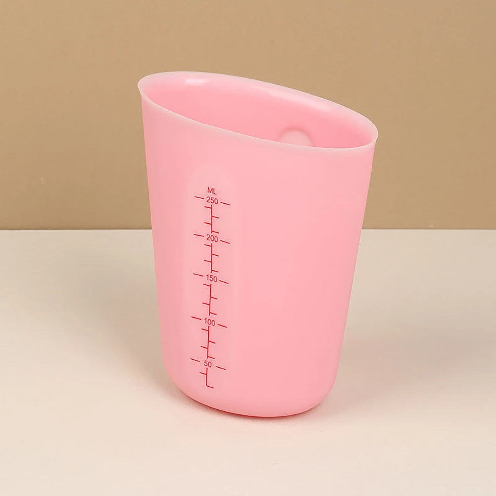 verre mesureur rose moyen