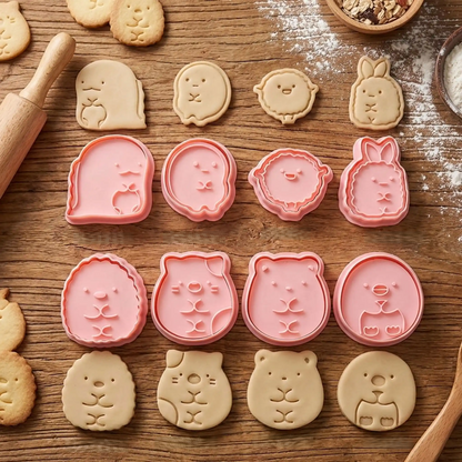 Emporte piece pour biscuits avec biscuit rose sur table bois 