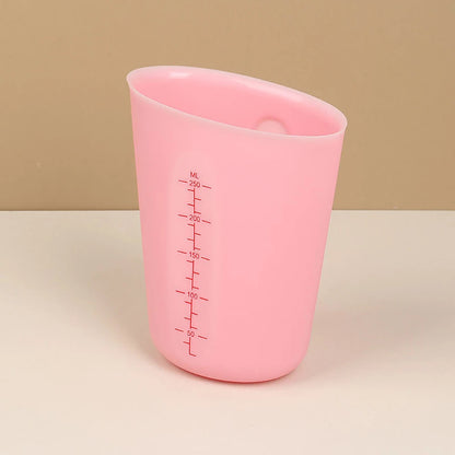 verre mesureur rose moyen